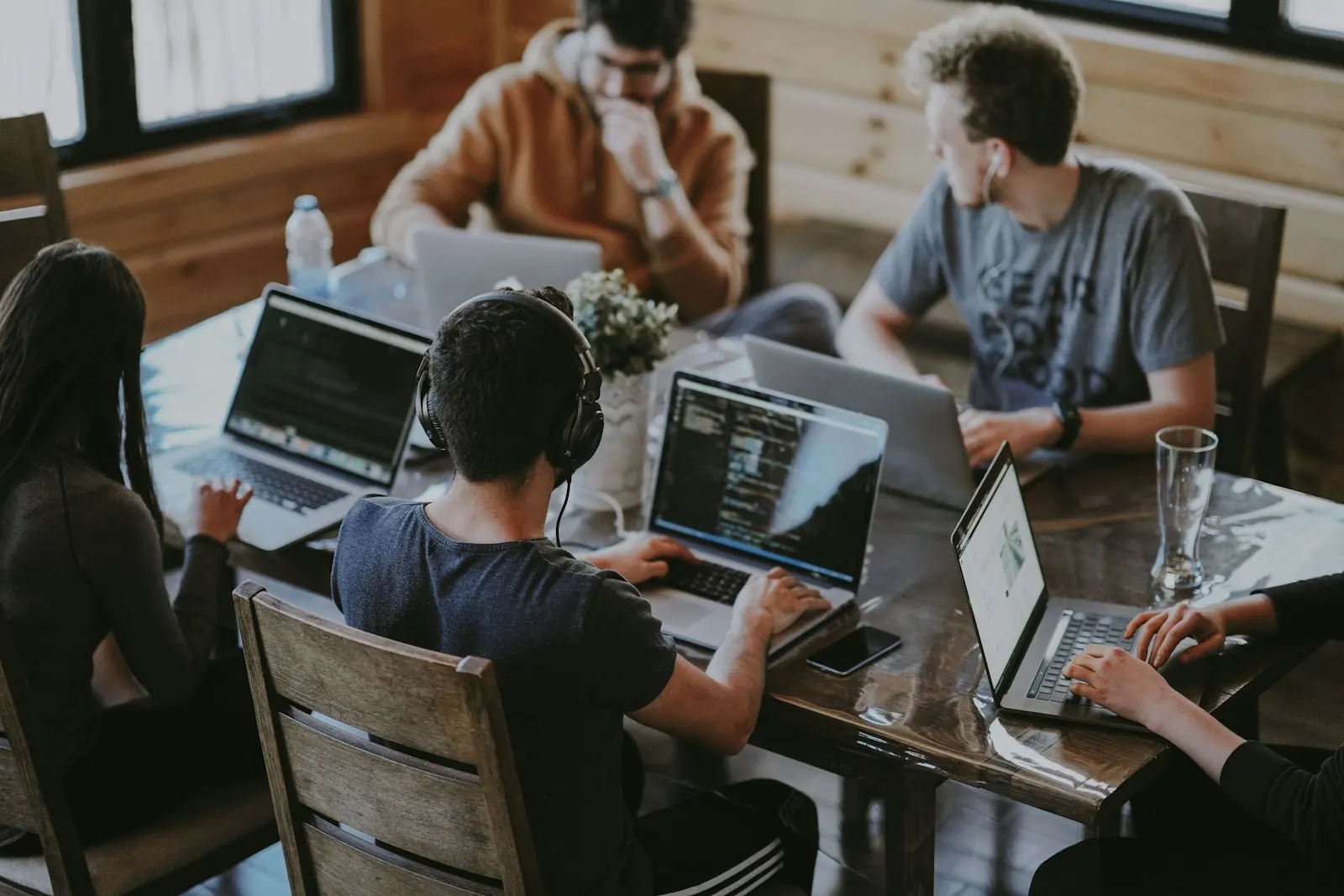 Team of developers working together on laptops